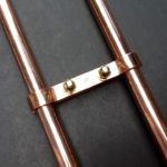 Copper bracket for shower mixer taps