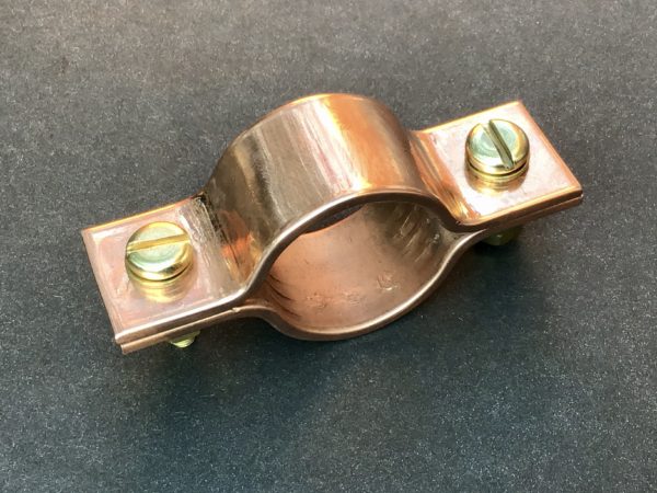 Copper clamping brackets for pipes and tubes